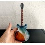 Miniatura de Guitarra con ola marina